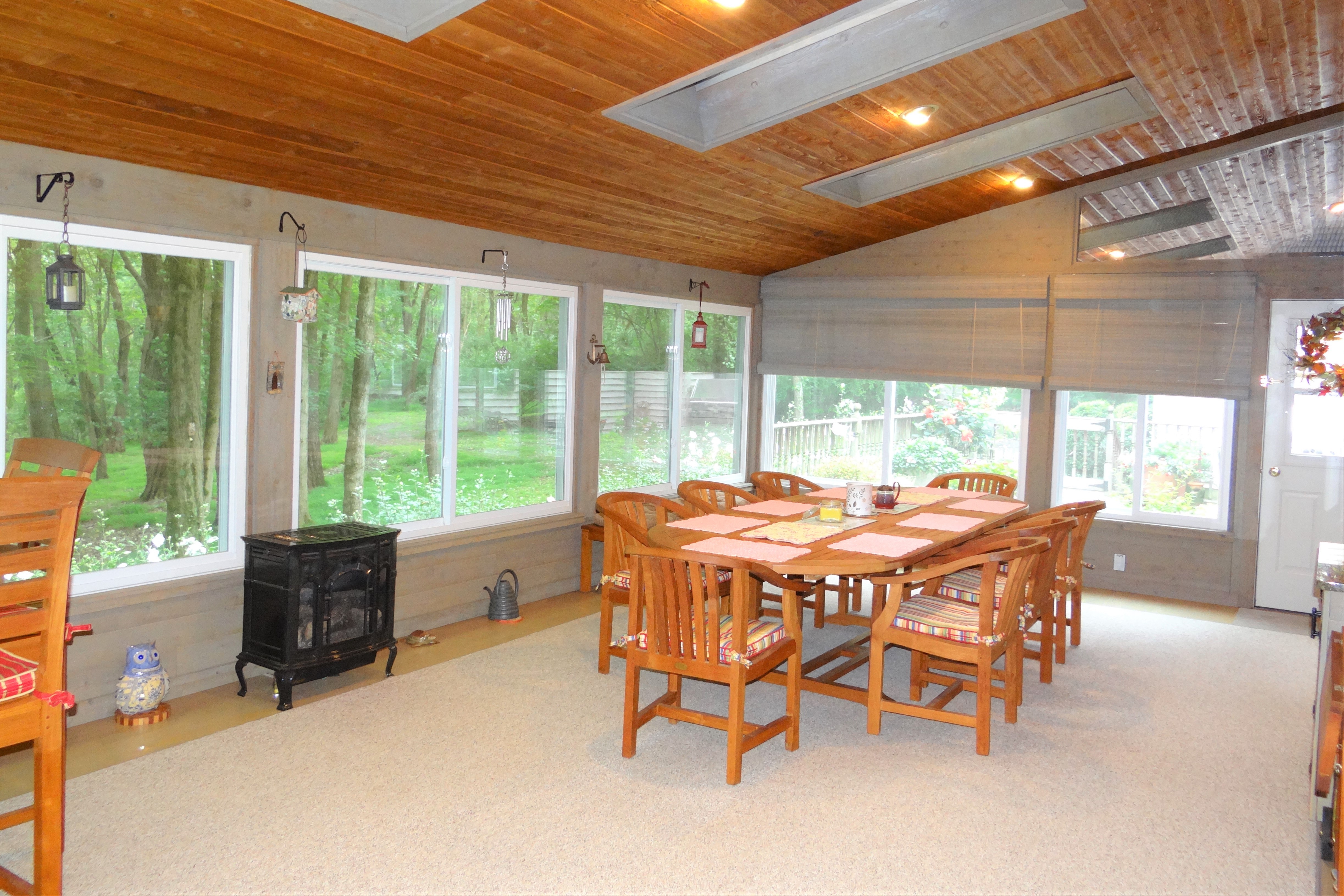 a sunroom with wood stove in pocopson township west chester, pa 19382 built by deluca construction